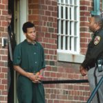 Convicted DC sniper Lee Boyd Malvo being escorted out of prison